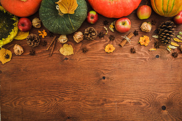 Thanksgiving day, autumn background. Pumpkin, melon and apples fruit on wooden background. Flat...