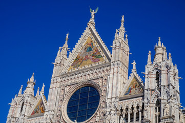 Naklejka premium Upper facade mosaic above Siena cathedral