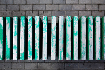 Obraz premium Aqua green vintage bench in park background