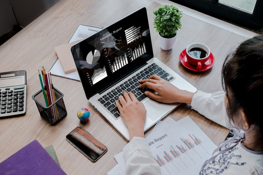 Business woman discussing data on laptop computer. Business concept.