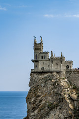 Fototapeta na wymiar Amazing castle Swallow's Nest on a rock at the Black Sea, Crimea. Scenic panoramic view of Crimea southern coast. Architecture and nature of Crimea