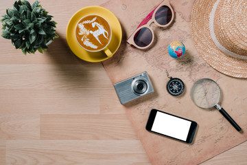Flat lay traveler accessories on wooden background,Essential vacation items with copy space.
