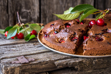 chocolate cake with cherries and mint leaves
