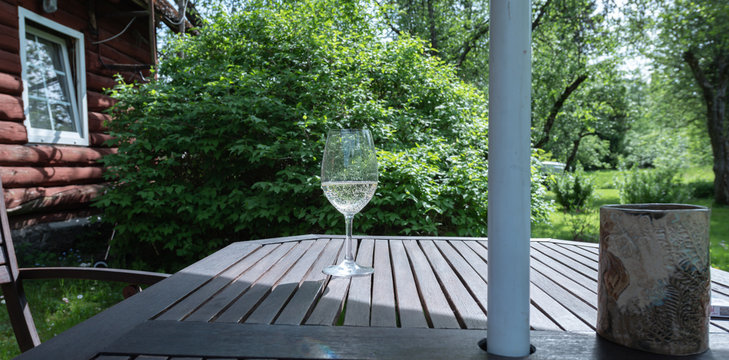 Glass Of Champange In Wooden Table