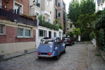 Typical house front, and car in the quiet streets of Montmartre in Paris, France