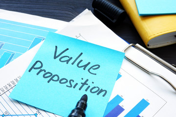 Value proposition. Financial documents with business figures.