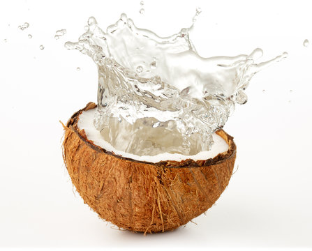 water splashing from a coco nut isolated on white