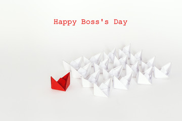 Boss day background with red paper ship leading white boats. Happy boss day concept.