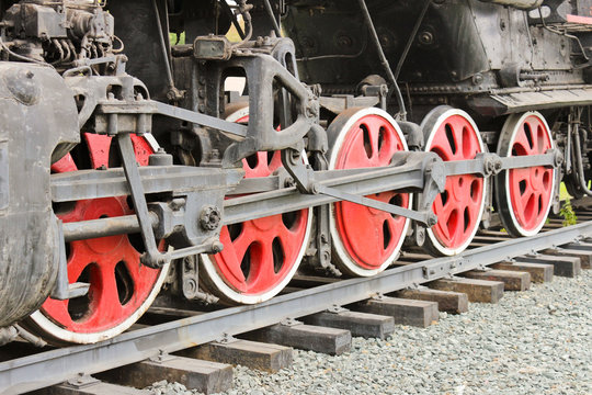 The wheels of the old steam locomotive