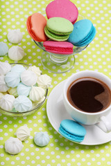 A cup of coffee and macaroons ready for breakfast