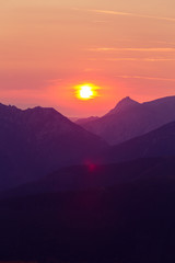 A beautiful, colorful sunrise sceney in mountains in purlpe tone. Abstract, minimalist landscape in Tatra mountains. Color gradients. Tatra mountains in Slovakia, Europe.