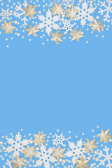 Fototapeta na wymiar Snowflake and star christmas abstract background border on blue. Festive card for the Christmas holiday and winter season with copy space. 