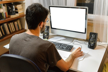 young man sitting at the computer