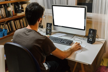 young man sitting at the computer