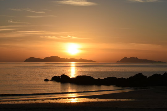 sunset at the samil beach, with the golden sky painted by the sunlight