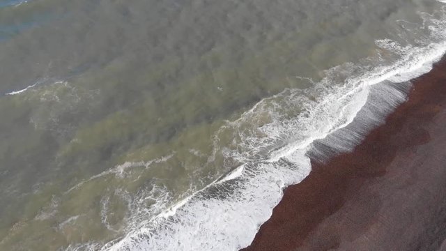 Drone flying above sea and beach at Weybourne near Sheringham uk