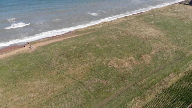 Drone flying over cliffs to sea at Weybourne near Sheringham uk