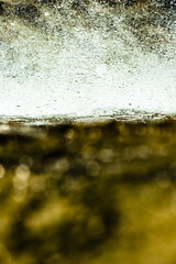 Water abstract with white and golden yellow colors.