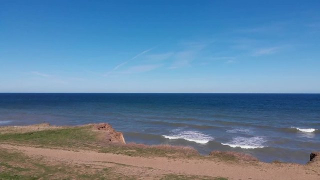 Drone flying over cliffs and sea at Weybourne near Sheringham uk