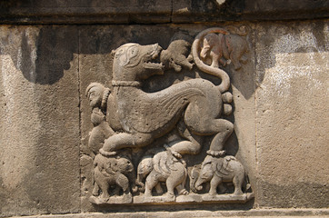 Carved wall showing a sharabha lifting elephants in its bare paws. Dakshin Kashi Mandir. Mahuli Sangam. Satara. Maharashtra