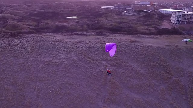 Really nice drone footage of a parapenter soaring on the Dutch dunes. Shot was taken by a professional drone pilot.