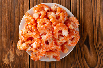 top view studio shot of peeled shrimps on a dish