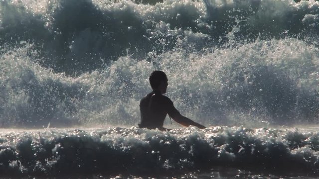 Surfer on Blue Ocean Wave Getting Barreled. 4K