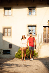 Young couple exploring ancient village Smartno in slovenia in early summer