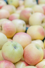 Yellow-red apples in a supermarket. vertical photo. healthy food