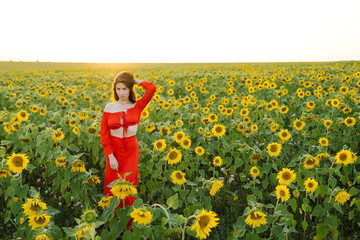 Fototapeta premium Beauty joyful girl in sunflower field