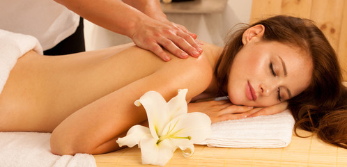 Fototapeta na wymiar Body care. Spa body massage treatment. Woman having massage in the spa salon