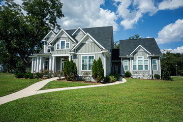 Gray New Construction Modern Cottage Home with Hardy Board Siding and Teal Door with Curb Appeal