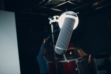 Sound engineer holding a microphone © primipil