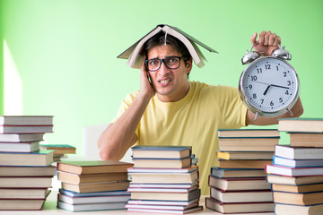 Student with too many books to read before exam