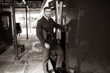 Good looking ww2 male air force officer in uniform boarding train