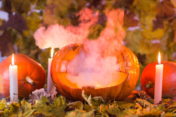 Jack-o-Lantern halloween pumpkin with mist pouring from its mouth