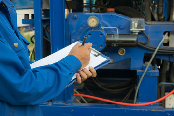 Engineer woman in industry factory checking production.