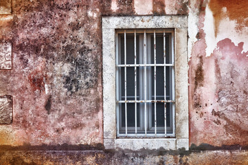 Fototapeta na wymiar Old window on the red wall 
