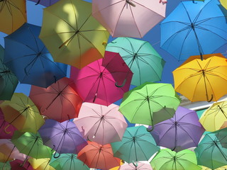 colorful umbrellas on a background of blue sky
