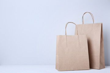 Brown shopping bags on grey background