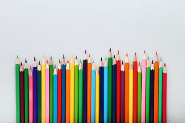 Colored pencils on grey background