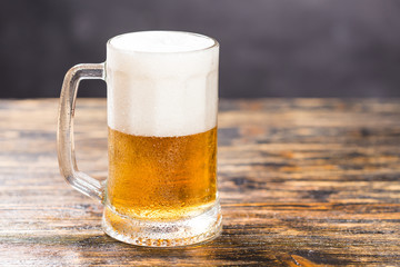 Food and drink concept - Glass beer on wood background with copy space