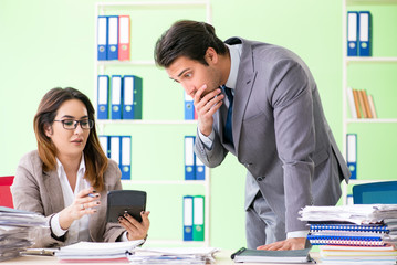 Two financial specialists working in the office