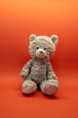 Cute teddy bear soft toy on background with copy space