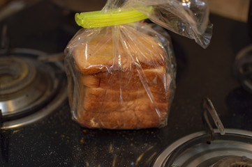 Packet of bread wrapped by plastic and tied