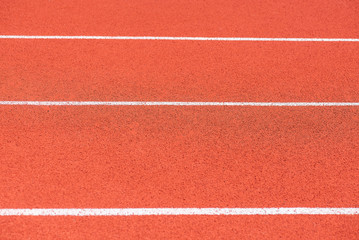 Fototapeta premium Close up of Running track pattern background in stadium.