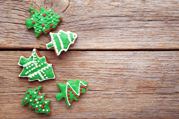 Christmas gingerbread cookies on grey wooden table