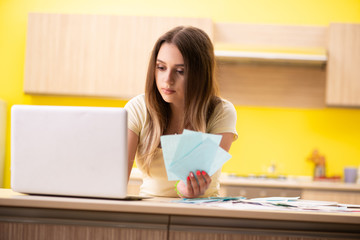Young woman wife in budget planning concept