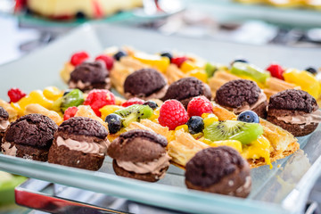 Assorted desserts puffs tarts puddings cakes creme brulee