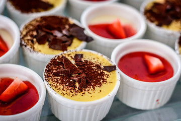 Assorted desserts puffs tarts puddings cakes creme brulee